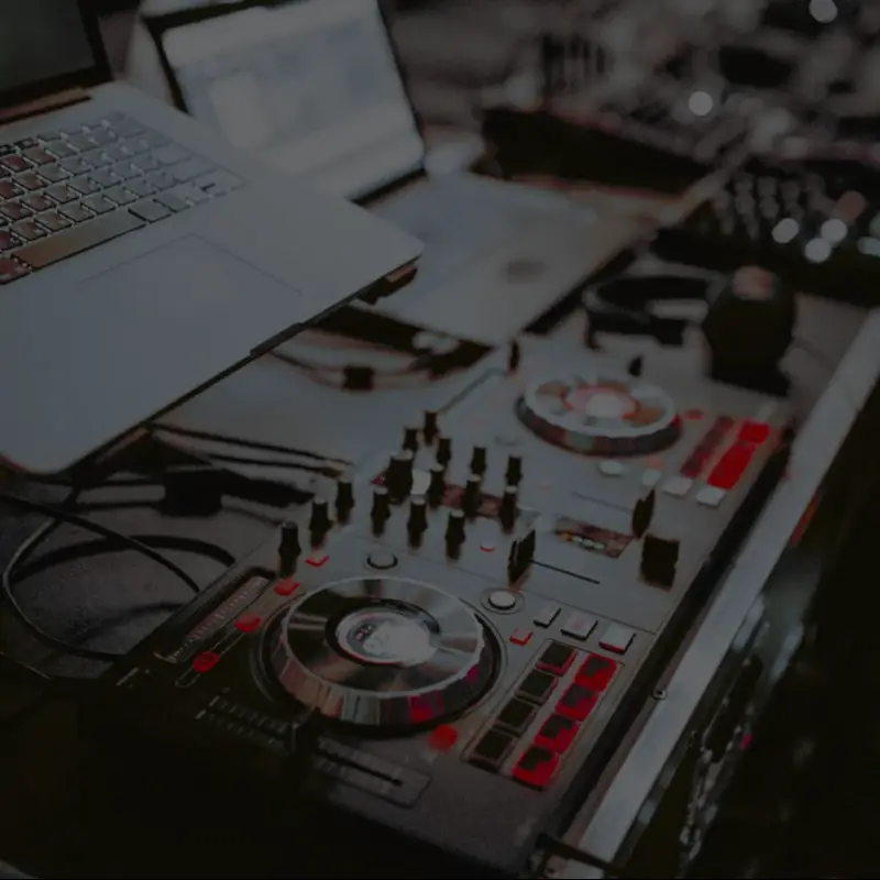 DJ controller and laptop on mixing console