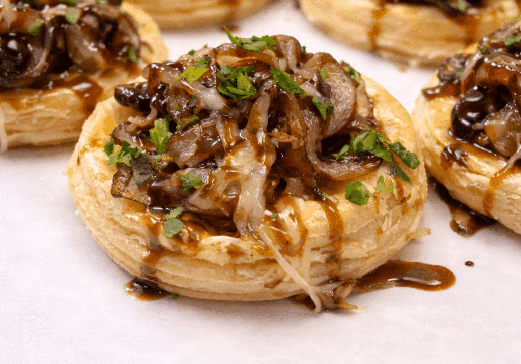 Puff pastry tartlets topped with caramelized onions