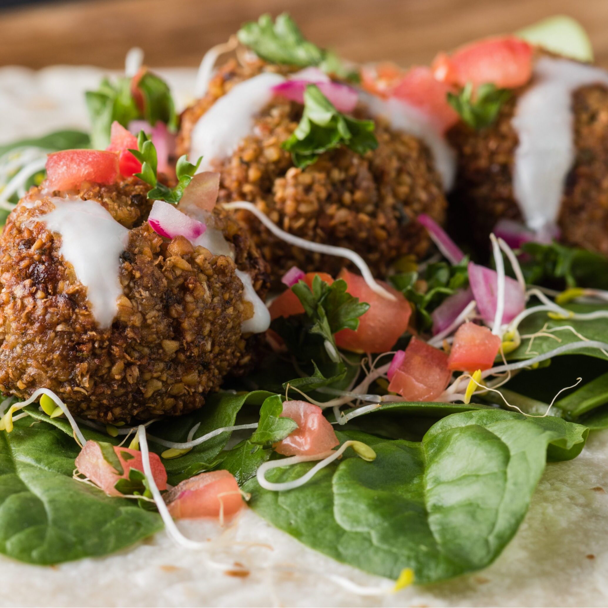 Falafel wrap with greens, tahini drizzle