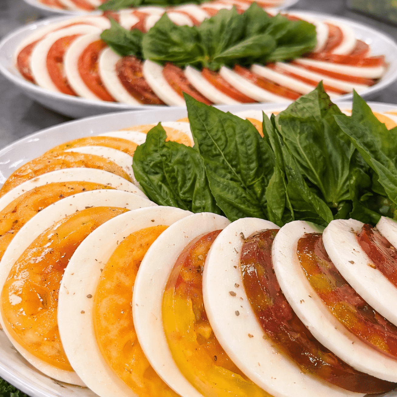 Caprese salad with red and yellow tomatoes